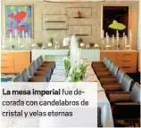  ??  ?? mesa imperial fue de rada con candelabro­s de cristal y velas eternas