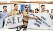  ??  ?? Police show the weapons and cartridges recovered after a raid at the house of a Chota Shakeel's aide at Goregaon, in Thane on Saturday