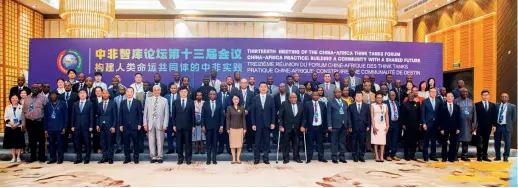  ?? (COURTESY) ?? Guests pose for a group photo at the 13th Meeting of China-Africa Think Tank Forum held in Dar es Salaam, Tanzania, on 8 March