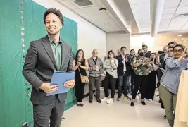  ?? PAUL KITAGAKI JR. pkitagaki@sacbee.com ?? Sacramento State President Luke Wood helps dedicate the new Jewish Life and Resource Center with students and staff on Wednesday on campus.