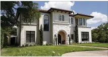  ?? DEBORAH CANNON / AMERICAN-STATESMAN ?? Gov. Greg Abbott lived at this home at 2601 Wooldridge Dr. in Austin when he was Texas attorney general. He says he had issues with the city over trees on the property.