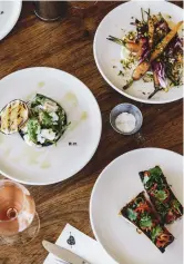  ??  ?? Inventive dishes, such as chargrille­d squid, romesco nero and roast lemon (above left), share space with Willow Creek wines at the Rare Hare cellar-door bistro (above centre and right); Wayne and daughter Holly Klintworth from Bass &amp; Flinders Distillery (below); Negroni hour