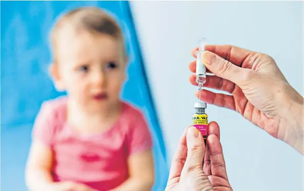  ??  ?? Controvers­ial vaccine: while most children in the UK today receive the MMR vaccine, a paper published two decades ago linking it with autism scared many parents, creating a wave of hysteria around the jab