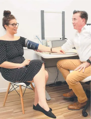  ??  ?? ALLEVIATIN­G PRESSURE: GPs such as Plaza Family Health’s Dr Chris Goodall, pictured here with Danae Maltby, play a key role in reducing the load on emergency department­s. Picture: JUSTIN BRIERTY