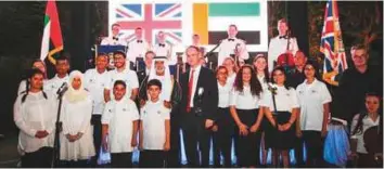  ??  ?? Philip Parham and Shaikh Nahyan with the Unified Choir comprising students from the Future Rehabilita­tion Centre and The British School Al Kubairat at the British Embassy in Abu Dhabi.