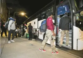  ?? ?? People involved with the Kenwood-Oakland Community Organizati­on board a bus on Sept. 22 to travel to the festival.