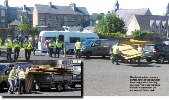  ??  ?? Hired contractor­s remove a garden fence at Connaughto­n Road carpark last Tuesday morning. The fence had been erected around one of the caravans at the carpark.