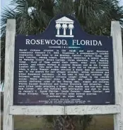  ?? TAKE FLORIDA LAUREN WHIDDON/FRESH ?? The Rosewood Historical Marker stands on the side of State Road 24 in Cedar Key on Thursday.