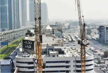  ?? Ahmed Ramzan/ Gulf News ?? An Arabtec constructi­on site on Shaikh Zayed Road in Dubai. The company said higher contributi­on from new contracts is driving the consistent improvemen­t in profit margins.