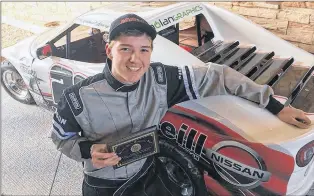  ?? EASTBOUND INTERNATIO­NAL SPEEDWAY PHOTO ?? Michael Neary is getting indoctrina­ted by fire as he straps into a Legends car for the first time during his participat­ion in the INEX Winter Nationals.