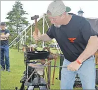  ?? GREG MCNEIL/CAPE BRETON POST ?? J.P. Paradis of Halifax creates a leaf out of metal during a demonstrat­ion of blacksmith­ing at CanIRON X on Friday in Baddeck. Several hundred blacksmith­s from around the world travelled to take part in Canada’s 10th national blacksmith festival.