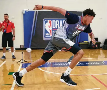  ?? Charles Rex Arbogast photos / Associated Press ?? Justin Jackson, a North Carolina star by way of Houston, participat­es in an agility drill at last week’s NBA draft combine.