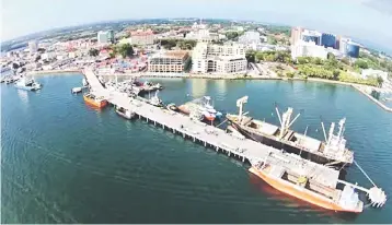  ??  ?? To ease and expedite cargo handling, the port is also equipped with a reach stacker (a vehicle used for handling intermodal cargo containers in small terminals or medium-sized ports).