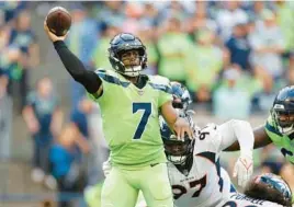  ?? STEPH CHAMBERS/GETTY ?? QB Geno Smith led the Seahawks over the Broncos on Monday night in Seattle. Smith was the backup for Russell Wilson, now with the Broncos, the last three years.
