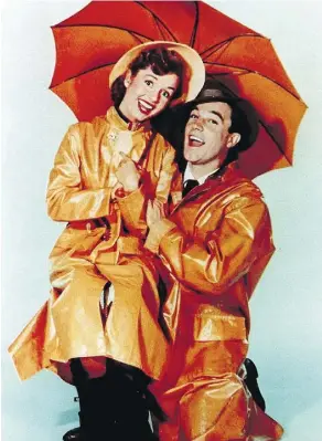  ?? STRINGER AFP GETTY IMAGES ?? Gene Kelly and Debbie Reynolds star in Singin’ in the Rain, which is being directed at moms in a special Mother’s Day screening and then again on May 17 at select theatres.