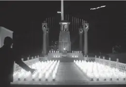  ?? — PTI ?? Army jawans light lamps at the Kargil War Memorial to pay tribute to martyrs on the 15th Kargil War anniversar­y at Drass, Jammu and Kashmir, on Friday.