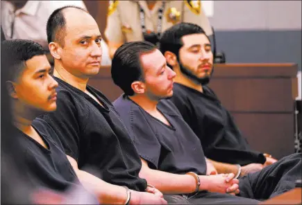  ?? K.M. Canno ?? Las Vegas Review-journal @Kmcannonph­oto Former Marine Walter Laak, second from left, waits for sentencing at the Regional Justice Center on Tuesday. He was found guilty but mentally ill on 12 counts, including attempted murder with a deadly weapon, for a 2016 attack on a pastor.