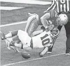 ?? JOSEPH MAIORANA/ USA TODAY ?? Indiana running back David Ellis fumbles while defended by Ohio State’s Pete Werner.