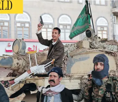  ?? HANI MOHAMMED / THE ASSOCIATED PRESS ?? Houthi Shiite fighters guard a street leading to the residence of former Yemeni president Ali Abdullah Saleh on Monday after he was killed by Shiite rebels in a chain of events that could plunge Yemen into new chaos.