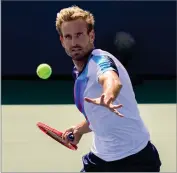  ?? AP PHOTO BY SETH WENIG ?? Peter Gojowczyk, of Germany, returns a shot to Henri Laaksonen, of Switzerlan­d, during the third round of the US Open tennis championsh­ips, Friday, Sept. 3, in New York.