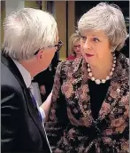  ??  ?? TENSE: Juncker and Mrs May clashed