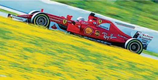  ?? Foto: Jens Büttner, dpa ?? Es geht bergauf: Formel--Pilot Sebastian Vettel hat bei den Testfahren in Barcelona mit seinem Ferrari geglänzt.