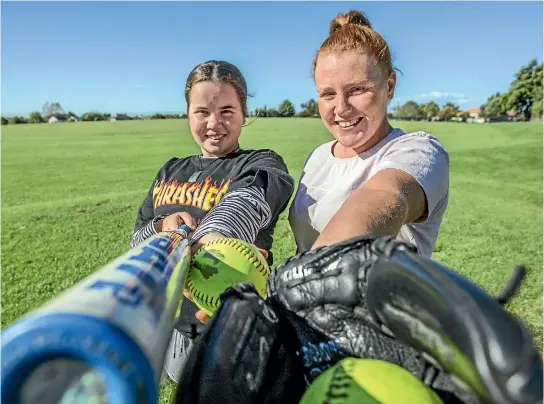  ??  ?? Atawhaia Whiu, 14, left, and Kaitlyn Hastie, 15, are looking forward to playing against one another at the Aorangi Softball Associatio­n’s annual women’s tournament in Timaru.