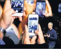  ?? AP PHOTO/MARCIO JOSE SANCHEZ ?? In this Sept. 7 file photo, Apple CEO Tim Cook announces the new iPhone 7 during an event to announce new products, in San Francisco.