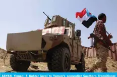  ?? — AFP ?? ABYAN, Yemen: A fighter loyal to Yemen’s separatist Southern Transition­al Council (STC) holds the separatist flag in this southern province on May 18, 2020.