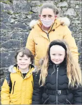  ??  ?? Valerie Finn pictured with Seán Gubbins and Ellie Finn, outside Bunscoil na Toirbhirte, Mitchelsto­wn earlier this week before the children returned to school, all smiles.