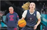  ?? ERIC GAY/AP PHOTO ?? In this April 2, 2022, file photo, UConn’s Paige Bueckers dribbles during a practice session at the Women’s Final Four in Minneapoli­s.