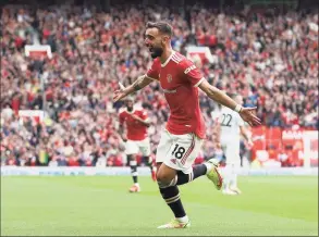  ?? Catherine Ivill / Getty Images, ?? Manchester United’s Bruno Fernandes celebrates after scoring against Leeds United on Saturday in Manchester, England.