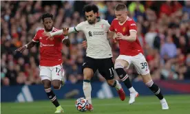  ?? Photograph: Tom Jenkins/The Guardian ?? Fred (left) and Scott McTominay, trying here to halt Liverpool’s Mohamed Salah, are not strong enough options in midfield.