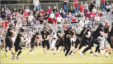  ?? Mark Humphrey/Enterprise-Leader ?? Prairie Grove senior quarterbac­k Luke Vance pitches the football to junior halfback Jace Edwards during the Tigers’ 41-14 loss to the Blackhawks in the 5A West Conference opener for both teams on Friday, Sept. 22, 2023, at Prairie Grove’s Tiger Den Stadium. Prairie Grove lost 52-12 at Harrison Friday.