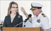  ?? Daniel Kramer Getty Images ?? GABRIELLE GIFFORDS with her husband, retired astronaut and Navy Capt. Mark Kelly, at the event.