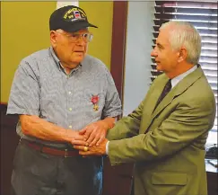  ?? Submitted photo ?? U.S. Sen. Jack Reed shakes the hand of Army veteran James Coppola, 91, of North Smithfield, at Reed's office Wednesday in Cranston.