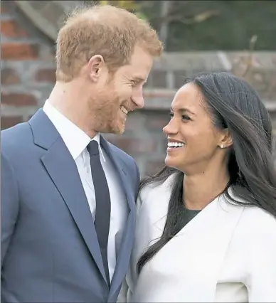  ?? Chris Jackson/Getty Images ?? Prince Harry and actress Meghan Markle announce their engagement Monday at The Sunken Gardens at Kensington Palace in London.