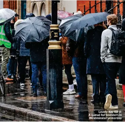  ?? ?? Lovely day for it: A queue for boosters in Westminste­r yesterday