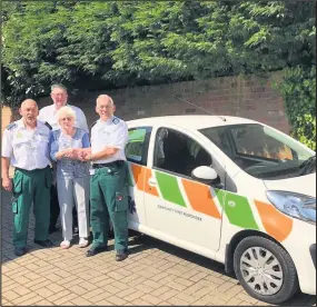  ??  ?? Joyce Beaman handing the keys to her late husband’s car over to Peter Blount, Wolds CFR scheme co-ordinator, with fellow responders Howard Cox and Paul Howitt looking on.