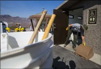  ??  ?? Custodian Terry Eddington said that her normal work day in Death Valley makes her sweat so much that she rarely needs to use the restrooms she cleans.