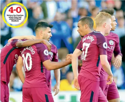  ??  ?? Manchester City’s Sergio Aguero (second left) celebrates his goal with teammates against Brighton during the Premier League match. —