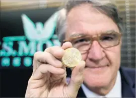  ?? Eric Gay Associated Press ?? GOLD “is a way of protecting wealth,” says gold coin seller Philip Diehl in Austin, Texas. “It’s like auto insurance or house insurance.” But experts warn of risks.