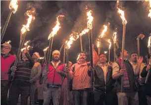  ?? AP ?? Indians participat­e in a torchlight procession to protest against the Citizenshi­p Amendment Bill in Gauhati on Monday.