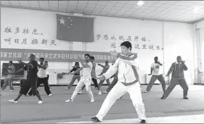  ?? YANG YANG / CHINA DAILY ?? A martial arts training program is offered by the Tianjin Huo Yuanjia Civil and Military School for kung fu fans from Africa.