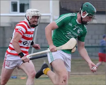  ??  ?? Eoin Molloy of Naomh Eanna is chased by Brendan Jordan (Ferns St. Aidan’s).