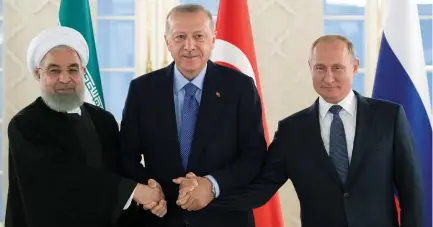 ?? (Reuters) ?? PRESIDENTS HASSAN ROUHANI of Iran, Recep Tayyip Erdogan of Turkey and Vladimir Putin of Russia take part in a trilateral meeting in Ankara yesterday.