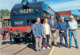  ?? THNSW ?? Change of owner: From left are the Secretary for Small Business, Lou Amato, NSW Transport Asset Holding Entity chief executive Benedicte Colin, Nathaniel Smith MP, Transport Heritage NSW chief executive Andrew Moritz, and David Sommervill­e, one of the locomotive’s former owners, sharing the spotlight with No. 6029 at NSW Rail Museum after the announceme­nt on May 7 that the UK-built Garratt had been purchased by the state government.