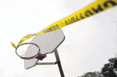  ?? JONATHON GRUENKE/STAFF ?? Basketball hoops are blocked with zip ties and covered in caution tape in March 2020 due to concerns about COVID-19.