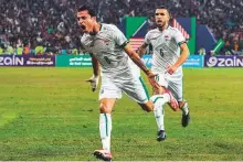  ?? AFP ?? ■ Iraq’s midfielder Ibrahim Bayesh (left) celebrates scoring the opening goal during the 25th Arabian Gulf Cup final against Oman at the Basra Internatio­nal Stadium.