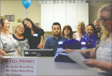  ?? NEWS-SENTINEL PHOTOGRAPH­S BY BEA AHBECK ?? Counselor Cheryl Wakeham and Tina Texiera stand together as they listen to the presentati­on by Tamara Metcalf, clinic manager, during an open house at Aegis/Healthy Connection­s Clinic in Lodi on Wednesday.